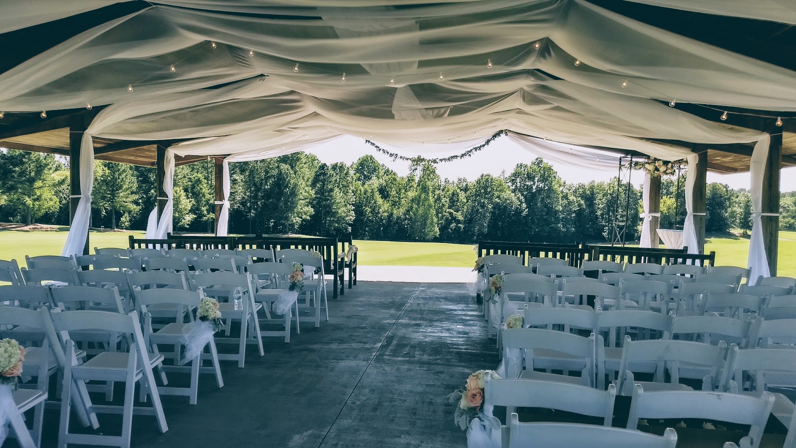 A white globe bistro accent for a drape canopy at Independence Golf Club